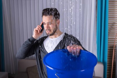Guy calling SuperClean Restoration Service for water damage